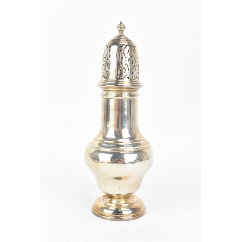 223 - An early 20th century silver sugar castor, makers marks and hallmarks rubbed, having a turned finial... 