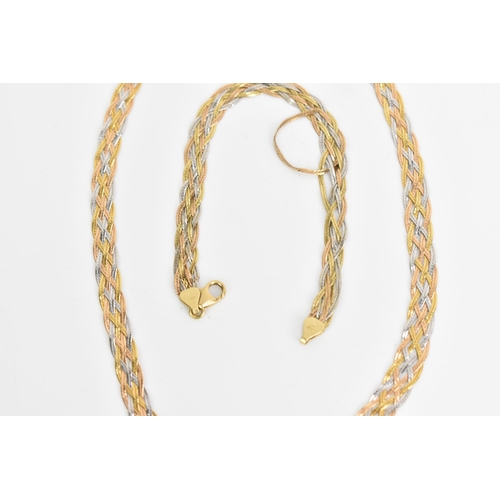 225 - An 18ct tri-coloured necklace and matching bracelet, each of woven interlocking design with lobster ... 