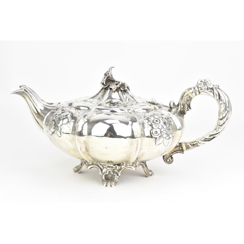 23 - A Victorian silver teapot, by Joseph Angell I & Joseph Angell II, hallmarked London 1844, the scroll... 