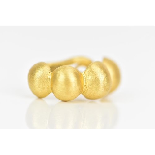 231 - A pair of 18ct yellow gold earrings, each designed as four graduated beads with lever backs, stamped... 