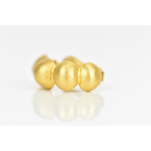 231 - A pair of 18ct yellow gold earrings, each designed as four graduated beads with lever backs, stamped... 