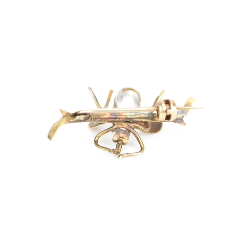 232 - A late Victorian yellow metal insect brooch, fashioned as a winged insect perched on a branch and in... 