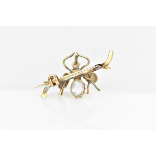 232 - A late Victorian yellow metal insect brooch, fashioned as a winged insect perched on a branch and in... 