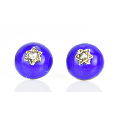 233 - A pair of Victorian yellow metal earrings, each of domed form with blue enamel and inset with an old... 