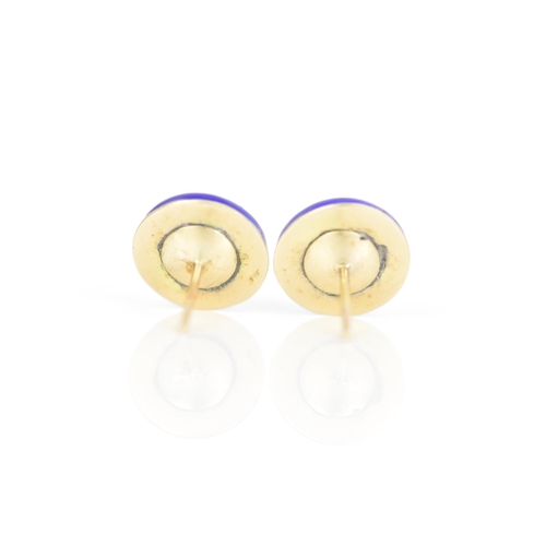 233 - A pair of Victorian yellow metal earrings, each of domed form with blue enamel and inset with an old... 