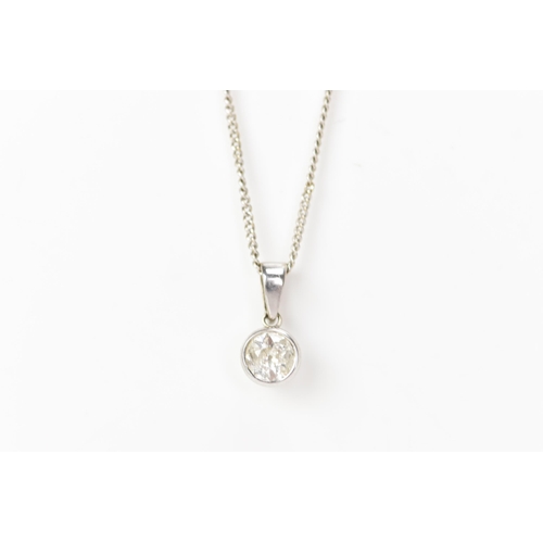 234 - An 18ct white gold and diamond necklace, the drop pendant inset with a single brilliant cut diamond ... 