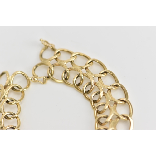 236 - A yellow metal bracelet, of articulated design with two rows of interlocking oval rings, with figure... 