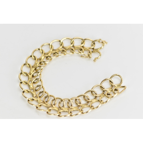 236 - A yellow metal bracelet, of articulated design with two rows of interlocking oval rings, with figure... 