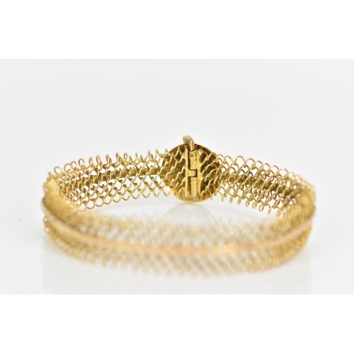 237 - A yellow metal bracelet, having an engraved band mounted to a chain link design and large button cla... 