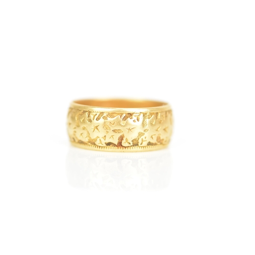 240 - An 18ct yellow gold wedding band, engraved with a floral design, ring size P 1/2, 7.4 grams
If there... 