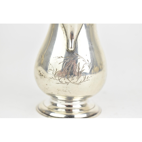 29 - A George II silver sparrow beak cream jug, by Elizabeth Goodwin, hallmarked London 1730, having a sc... 