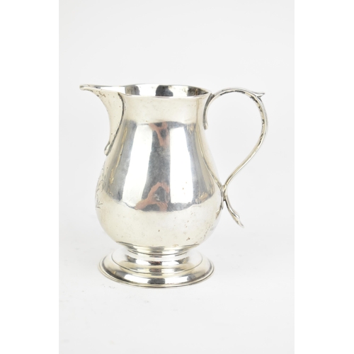 29 - A George II silver sparrow beak cream jug, by Elizabeth Goodwin, hallmarked London 1730, having a sc... 