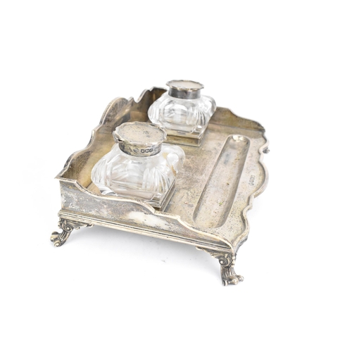 35 - A George V silver pen and ink stand, by William Hutton & Sons Ltd, hallmarked Sheffield 1920, having... 