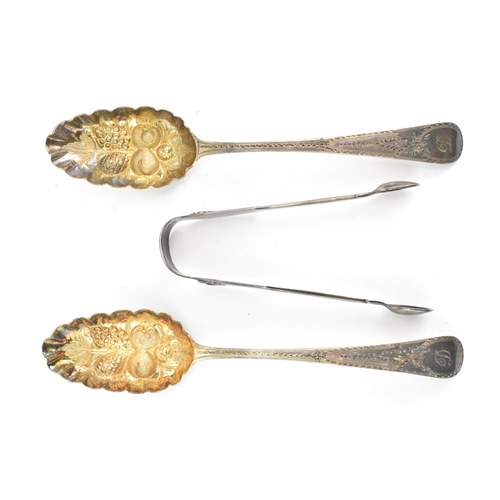 40 - Two George III silver berry spoons hallmarked London 1788, having fruit embossed bowls and bright-cu... 