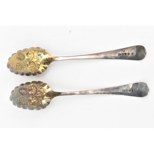 40 - Two George III silver berry spoons hallmarked London 1788, having fruit embossed bowls and bright-cu... 