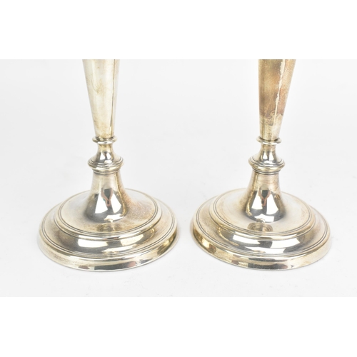 50 - A pair of Elizabeth II silver candlesticks, by W.E.Vokes, hallmarked London 1991, each with weighted... 