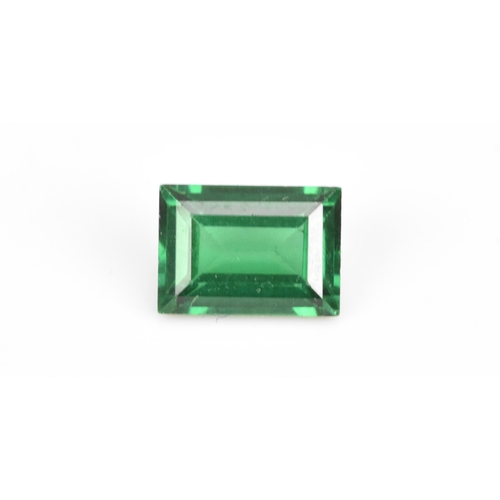 61 - A baguette cut green coloured loose gem stone, possibly a green topaz, 6.7mm x 4.7mm
If there is no ... 