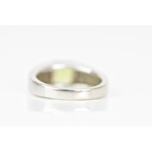 62 - A 14ct white gold and peridot dress ring, the peridot 5.3mm x 5.3mm, ring size M, 5.5 grams
If there... 