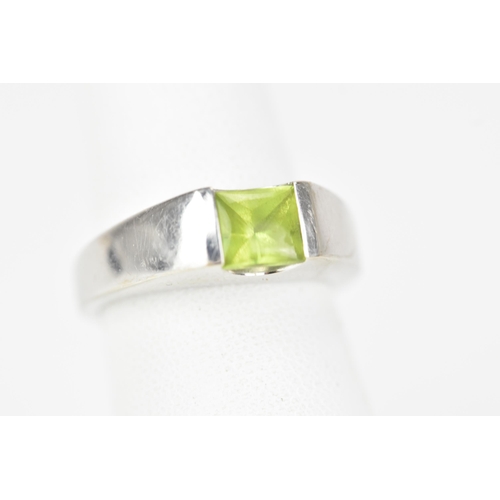 62 - A 14ct white gold and peridot dress ring, the peridot 5.3mm x 5.3mm, ring size M, 5.5 grams
If there... 