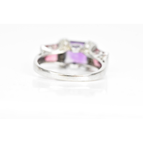 63 - A 14ct white gold amethyst and pink tourmaline dress ring, the cushion square cut amethyst 6.8mm wit... 