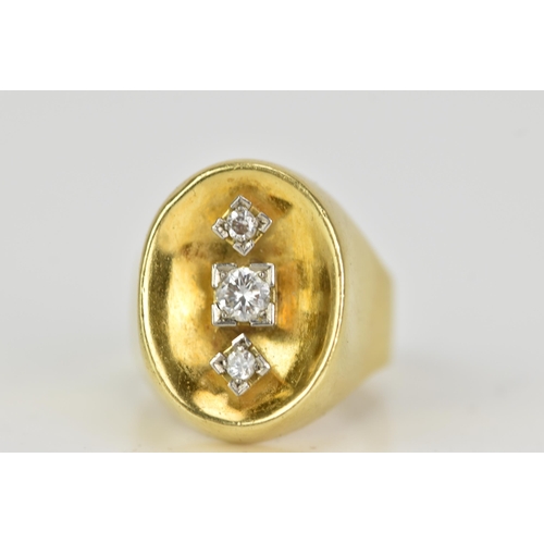 65 - A yellow gold and three stone diamond dress ring, the central diamond 3.2mm diameter flanked by two ... 