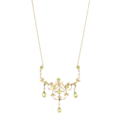 66 - An Edwardian 9ct gold necklace, set with eleven faceted cut peridots and thirty-three seed pearls, t... 