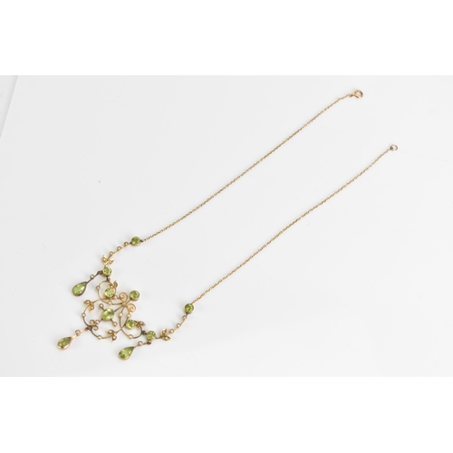 66 - An Edwardian 9ct gold necklace, set with eleven faceted cut peridots and thirty-three seed pearls, t... 