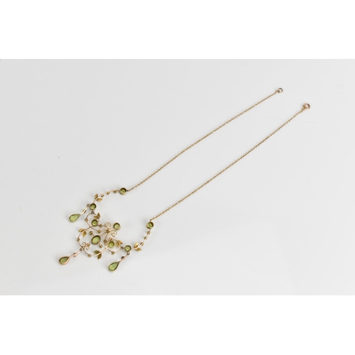 66 - An Edwardian 9ct gold necklace, set with eleven faceted cut peridots and thirty-three seed pearls, t... 