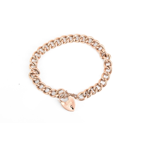 71 - A 9ct rose gold curb link chain bracelet, having a heart shaped padlock clasp and safety chain, stam... 