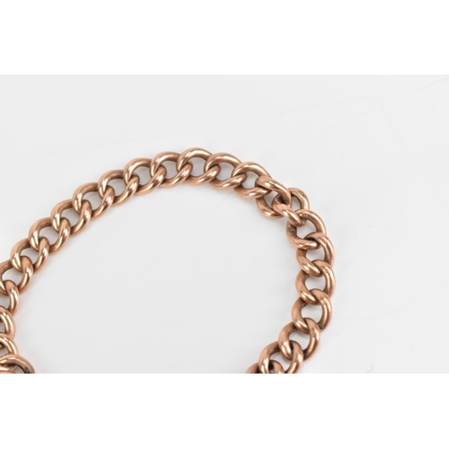 71 - A 9ct rose gold curb link chain bracelet, having a heart shaped padlock clasp and safety chain, stam... 