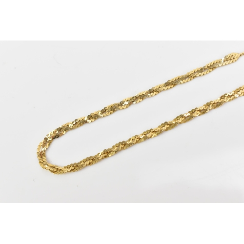 73 - An 18ct gold serpentine chain, having single strand to either end linked to strands of three entwine... 