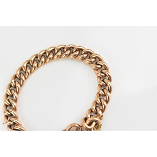 75 - A 9ct rose gold curb link chain bracelet, having a heart shaped padlock clasp and safety chain, appr... 