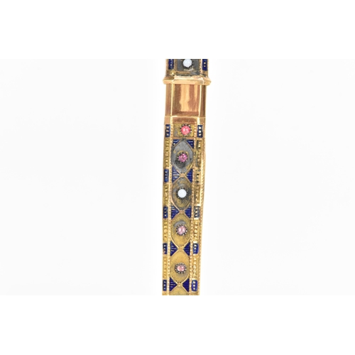 76 - A 19th century Egyptian revival gold needle case, of octagonal tapering form and embellished with bl... 