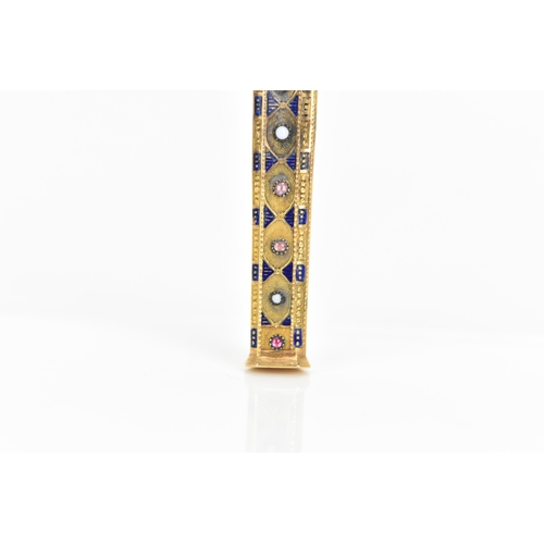 76 - A 19th century Egyptian revival gold needle case, of octagonal tapering form and embellished with bl... 