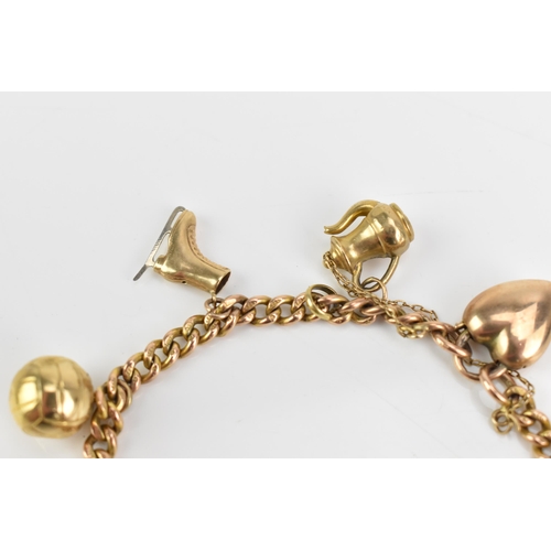 77 - A 9ct rose gold curb link charm bracelet, with various 9ct gold and yellow metal charms including a ... 