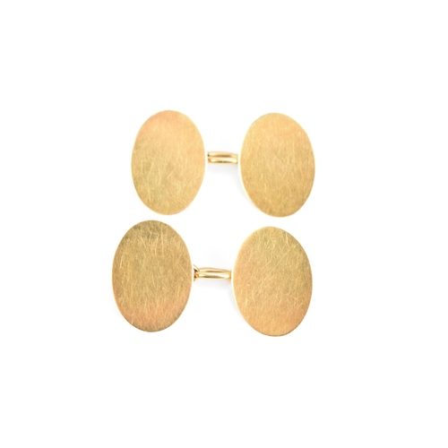 80 - A pair of 18ct gold cufflinks, each of oval shape with chain links, 18.2mm, 11.2 grams
If there is n... 