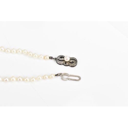 84 - A single strand Mikimoto cultured pearl necklace, with ninety-five spherical graduating cultured pea... 