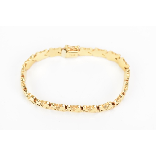 85 - An Italian UnoAerre 18ct gold fancy link bracelet, with an open box clasp, stamped 750, 18cm, 13.1 g... 