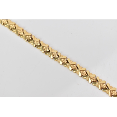 85 - An Italian UnoAerre 18ct gold fancy link bracelet, with an open box clasp, stamped 750, 18cm, 13.1 g... 