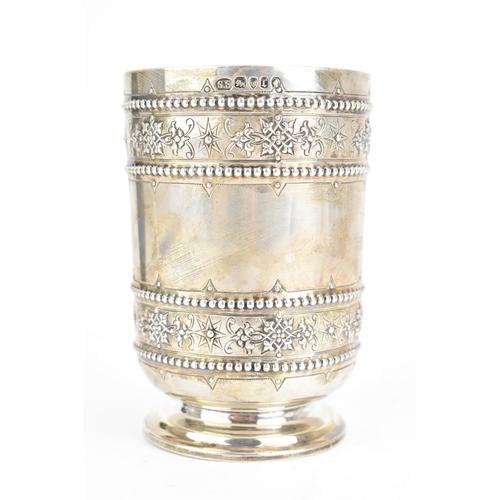 95 - A Victorian silver beaker, by S Smith & Son, hallmarked London 1872, of cylindrical form, embossed w... 