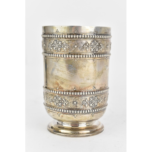 95 - A Victorian silver beaker, by S Smith & Son, hallmarked London 1872, of cylindrical form, embossed w... 