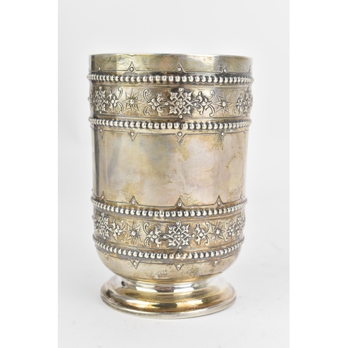 95 - A Victorian silver beaker, by S Smith & Son, hallmarked London 1872, of cylindrical form, embossed w... 