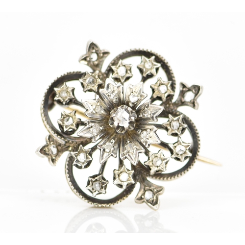 98 - A Victorian gold and white metal diamond floral brooch, the flowerhead en tremblant with central dia... 