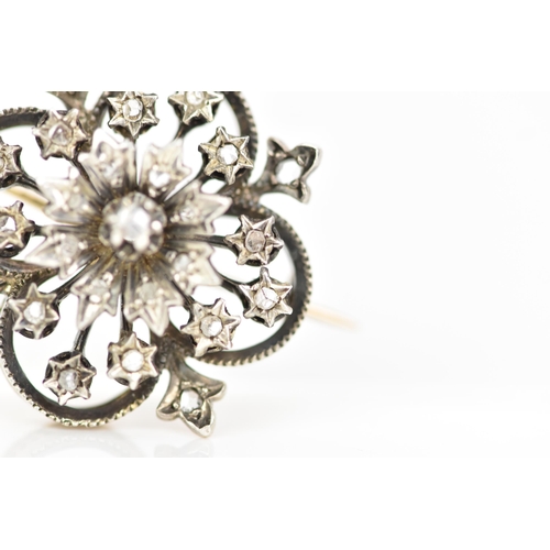 98 - A Victorian gold and white metal diamond floral brooch, the flowerhead en tremblant with central dia... 