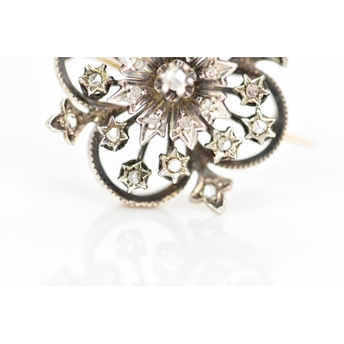 98 - A Victorian gold and white metal diamond floral brooch, the flowerhead en tremblant with central dia... 