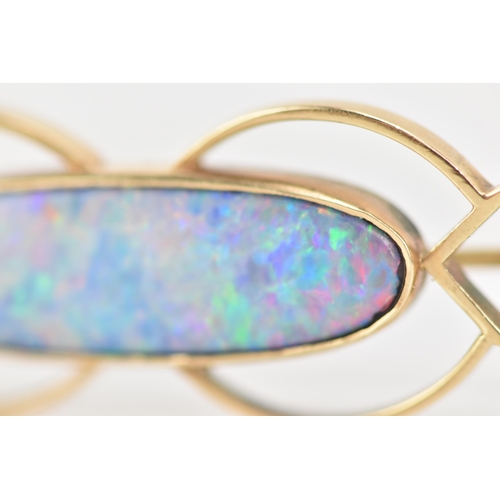 243 - A 9ct yellow gold and opal brooch, the oval opal 25.8mm x 7.7mm set in a pierced frame, stamped 9ct,... 