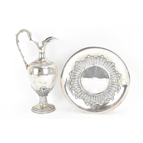 244 - An early 20th century continental white metal wine ewer and a tray, both stamped 900 KK, the ewer ha... 