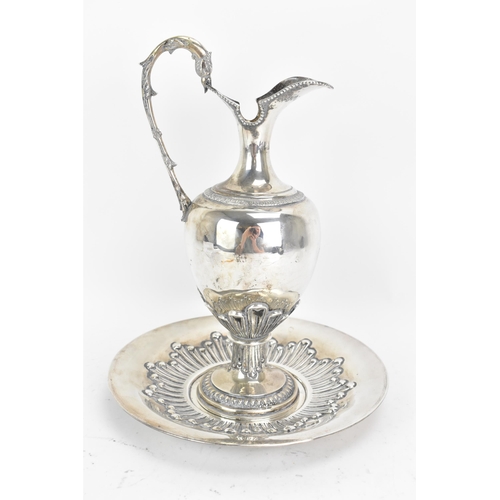 244 - An early 20th century continental white metal wine ewer and a tray, both stamped 900 KK, the ewer ha... 