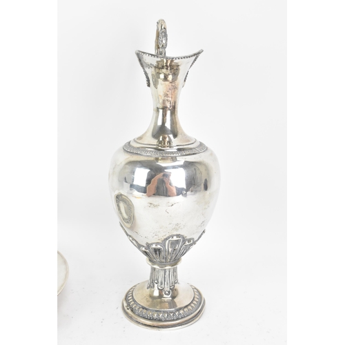 244 - An early 20th century continental white metal wine ewer and a tray, both stamped 900 KK, the ewer ha... 