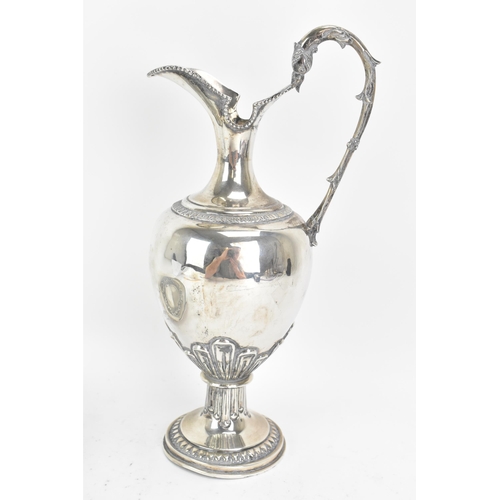 244 - An early 20th century continental white metal wine ewer and a tray, both stamped 900 KK, the ewer ha... 